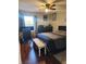 Spacious bedroom featuring a large bed and hardwood floors at 2606 Royal Fern Pl, Kissimmee, FL 34758