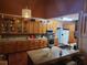 Well-equipped kitchen with wood cabinets and granite countertops at 2606 Royal Fern Pl, Kissimmee, FL 34758