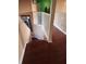 Elegant staircase with hardwood floors and white railing at 2606 Royal Fern Pl, Kissimmee, FL 34758