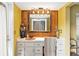 Bathroom with vanity, large mirror and wooden wall accents at 279 Tigerlily Ct, Altamonte Springs, FL 32714