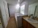 Main bathroom with soaking tub, separate shower, and double sinks at 4970 Poolside Dr, Saint Cloud, FL 34769