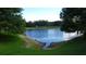 Serene pond view with lush green landscaping at 4970 Poolside Dr, Saint Cloud, FL 34769