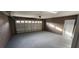 Spacious garage with painted floor and an attached door at 552 Brentford Ct, Kissimmee, FL 34758