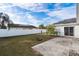 Private backyard with grassy area and patio space at 557 Dove Ct, Kissimmee, FL 34759