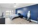 Bright bedroom with wood-look floors, ceiling fan, and window at 557 Dove Ct, Kissimmee, FL 34759