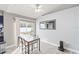 Dining area with glass-top table and chairs, near the kitchen at 557 Dove Ct, Kissimmee, FL 34759