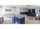 Modern kitchen with blue cabinets, granite countertops, and stainless steel appliances at 557 Dove Ct, Kissimmee, FL 34759