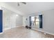 Living area with wood-look floors and a view of the front yard at 557 Dove Ct, Kissimmee, FL 34759