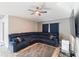 Living room features a large sectional sofa and a ceiling fan at 557 Dove Ct, Kissimmee, FL 34759