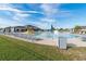 Community pool with lounge chairs and play area at 557 Dove Ct, Kissimmee, FL 34759