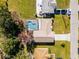 Aerial view of single Gathering home with pool and driveway at 607 Tamarin Ln, Kissimmee, FL 34759
