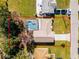 Aerial view of single Gathering home with pool and driveway at 607 Tamarin Ln, Kissimmee, FL 34759