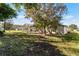 Spacious backyard with mature trees and pool at 607 Tamarin Ln, Kissimmee, FL 34759