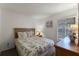 Bedroom with a queen-size bed and wood dresser at 607 Tamarin Ln, Kissimmee, FL 34759