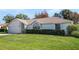 Charming one-story home with well-manicured lawn at 607 Tamarin Ln, Kissimmee, FL 34759