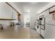 Kitchen offers white cabinets, stainless steel appliances, and an eat-in kitchen island at 607 Tamarin Ln, Kissimmee, FL 34759