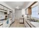 Bright kitchen featuring white appliances and ample cabinetry at 607 Tamarin Ln, Kissimmee, FL 34759