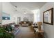 Spacious living room with vaulted ceilings, neutral decor, and ample natural light at 607 Tamarin Ln, Kissimmee, FL 34759
