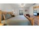 King-size bed and wood furniture in the main bedroom at 607 Tamarin Ln, Kissimmee, FL 34759