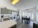 Well-equipped kitchen with gray cabinets and tile flooring at 644 Bent Oak Loop, Davenport, FL 33837