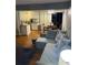 Open concept kitchen and living area with granite countertops at 7024 Moderna Way, Orlando, FL 32822