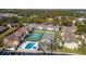 Aerial view of community with pool, tennis court, and playground at 8711 Rockingham Ter # C, Kissimmee, FL 34747