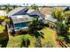 Aerial view of a home with a pool and lush landscaping at 905 Durango Loop St, Davenport, FL 33897