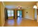 Spacious living room with tile floors and sliding glass doors at 9094 Outlook Rock Trl, Windermere, FL 34786