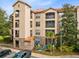 Attractive three story building with balconies and palm trees at 1301 Tuscan Ter # 9107, Davenport, FL 33896