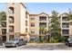 Tan three-story building with balconies and ample parking at 1301 Tuscan Ter # 9107, Davenport, FL 33896