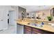 Kitchen features granite countertops and stainless steel dishwasher at 1301 Tuscan Ter # 9107, Davenport, FL 33896