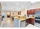 Modern kitchen with stainless steel appliances and granite countertops at 1301 Tuscan Ter # 9107, Davenport, FL 33896