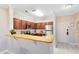 Modern kitchen with stainless steel appliances and granite countertops at 1301 Tuscan Ter # 9107, Davenport, FL 33896