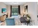 Living room with comfy sofa and access to a screened patio at 1301 Tuscan Ter # 9107, Davenport, FL 33896
