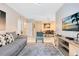 Living area with gray sofa and view of dining area at 1301 Tuscan Ter # 9107, Davenport, FL 33896