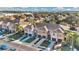 Aerial view of a row of tan townhouses in a residential neighborhood at 1336 Chelsea Dr, Davenport, FL 33897