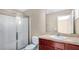 Bathroom with shower/tub combo and wood vanity at 1336 Chelsea Dr, Davenport, FL 33897