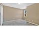 Bedroom with carpet flooring, neutral walls, and window at 1336 Chelsea Dr, Davenport, FL 33897