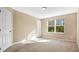 Well lit bedroom featuring carpet and window with blinds at 1336 Chelsea Dr, Davenport, FL 33897