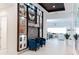 Bright entryway with a feature wall and blue accent chairs at 13809 Abberwick Dr, Orlando, FL 32832