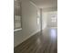 Spacious living area with hardwood floors and large windows at 2857 Lyndscape St, Orlando, FL 32833