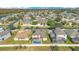 Aerial view showcasing home, pool, and surrounding landscape at 3571 Maple Ridge Loop, Kissimmee, FL 34741