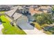 Two-story house with a large driveway and well-manicured lawn, located in a residential neighborhood at 3571 Maple Ridge Loop, Kissimmee, FL 34741