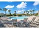 Inviting community pool with lounge chairs, perfect for relaxation at 3571 Maple Ridge Loop, Kissimmee, FL 34741