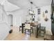 Elegant dining room with chandelier and seating for six at 3571 Maple Ridge Loop, Kissimmee, FL 34741
