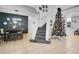 Spacious entryway with staircase and decorated Christmas tree at 3571 Maple Ridge Loop, Kissimmee, FL 34741
