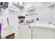 Well-organized laundry room with washer and dryer at 3571 Maple Ridge Loop, Kissimmee, FL 34741