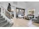 Comfortable living room with a white couch and large windows at 3571 Maple Ridge Loop, Kissimmee, FL 34741