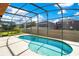 Relaxing screened pool with backyard view at 3571 Maple Ridge Loop, Kissimmee, FL 34741