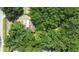 Aerial view showing the house nestled in a wooded area at 4914 Dove Ln, Auburndale, FL 33823